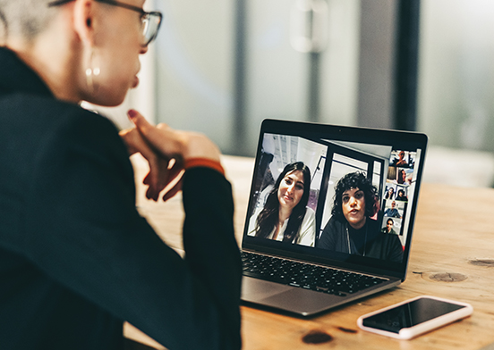 Three businesspeople talking in an online meeting